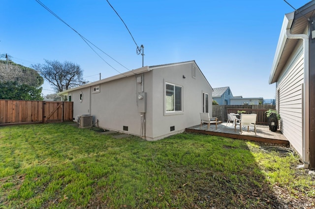 back of house with a yard, cooling unit, and a patio