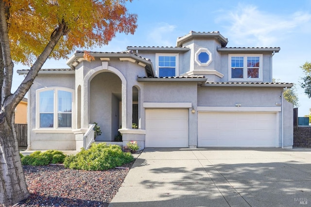 mediterranean / spanish house with a garage