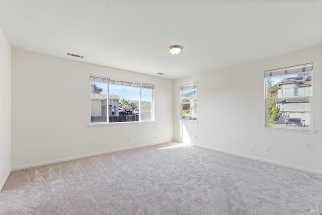 unfurnished room featuring carpet flooring