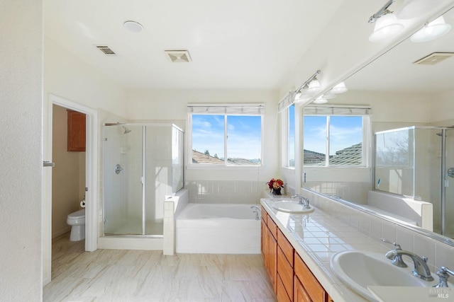 full bathroom featuring toilet, vanity, and plus walk in shower