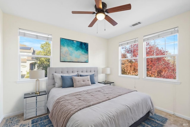 bedroom with ceiling fan and carpet