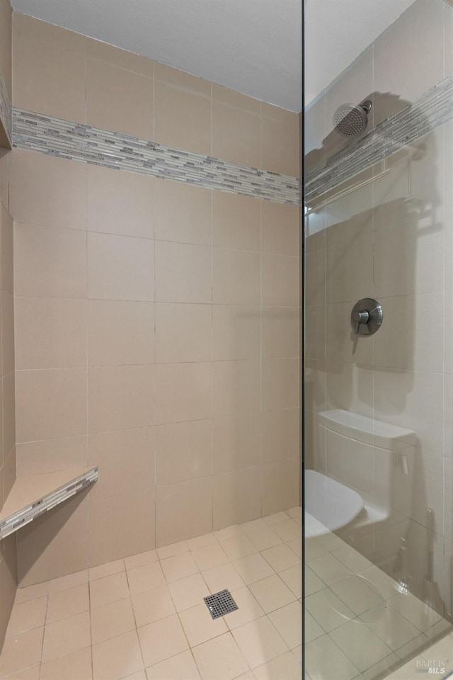 bathroom with tiled shower