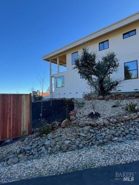 view of property exterior featuring a balcony