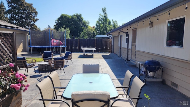 view of patio / terrace featuring a trampoline and a grill