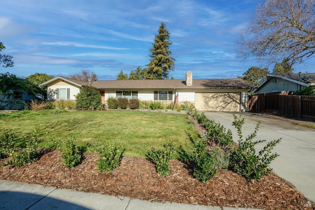 ranch-style house featuring a front lawn and a garage