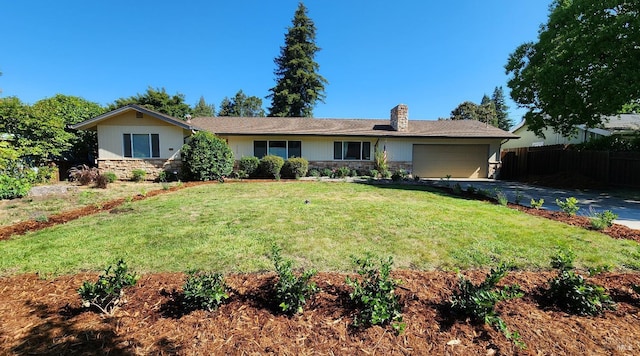 ranch-style house with a garage and a front lawn