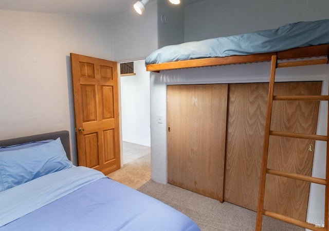 carpeted bedroom with a closet