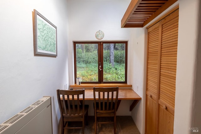 dining space with radiator and french doors