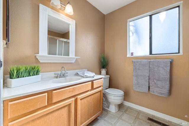 full bath featuring visible vents, toilet, vanity, baseboards, and tile patterned floors