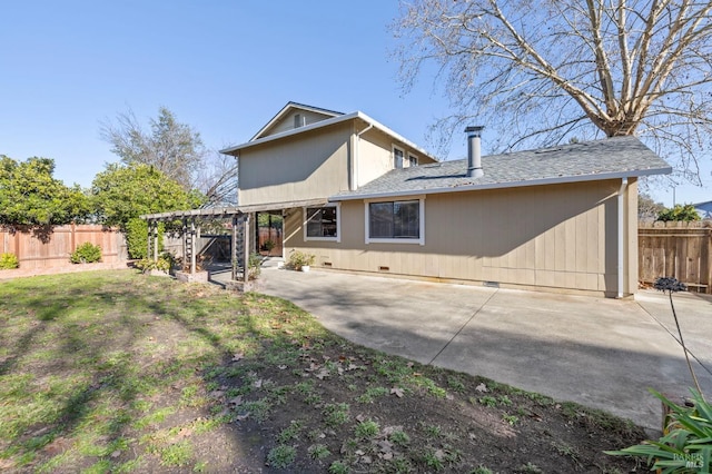 rear view of property featuring crawl space, a patio, fence, and a pergola