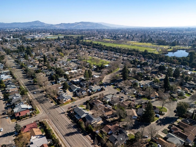 birds eye view of property featuring a residential view and a water and mountain view