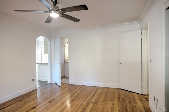 unfurnished room with ceiling fan, ornamental molding, and light hardwood / wood-style flooring