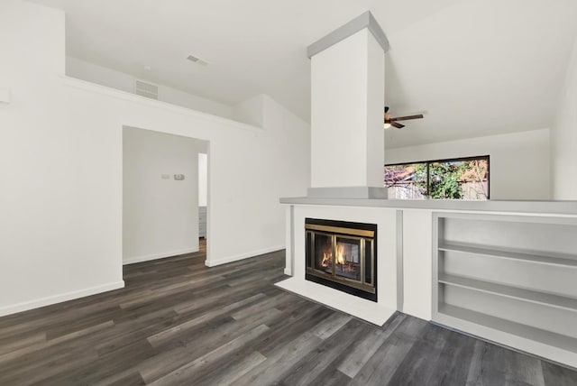 unfurnished living room with ceiling fan, built in shelves, dark hardwood / wood-style flooring, and lofted ceiling