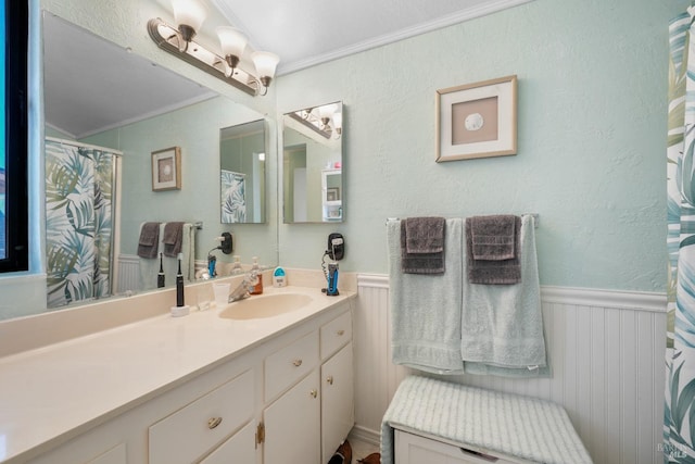 bathroom featuring vanity and crown molding