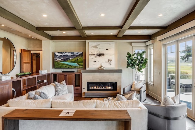 living room with a fireplace, hardwood / wood-style flooring, beam ceiling, and coffered ceiling