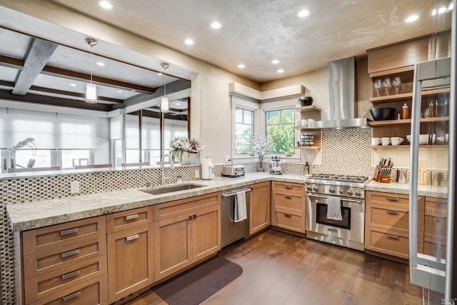 kitchen with wall chimney range hood, beam ceiling, sink, stainless steel appliances, and dark hardwood / wood-style flooring