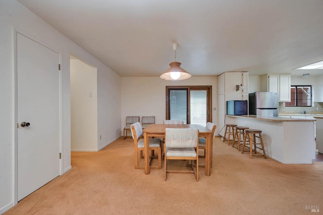 view of carpeted dining area