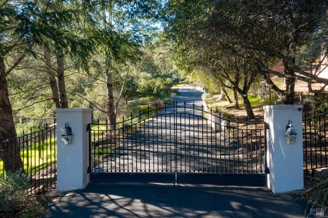 view of gate featuring fence