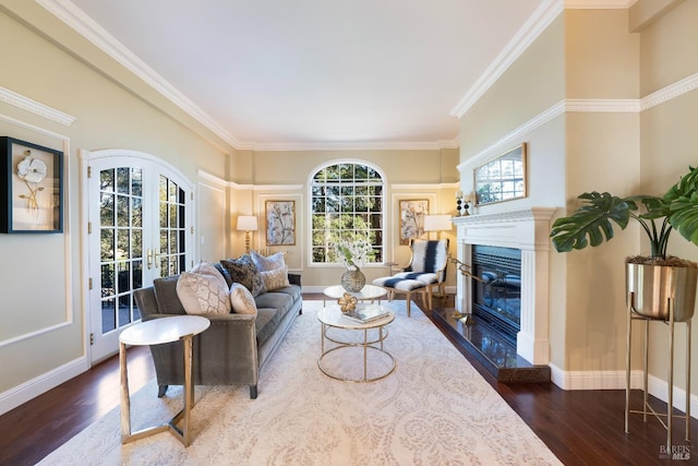 living room featuring french doors, a premium fireplace, wood finished floors, and baseboards