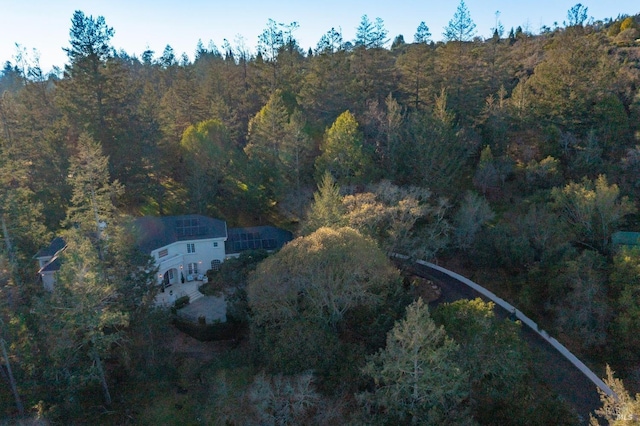 aerial view featuring a view of trees