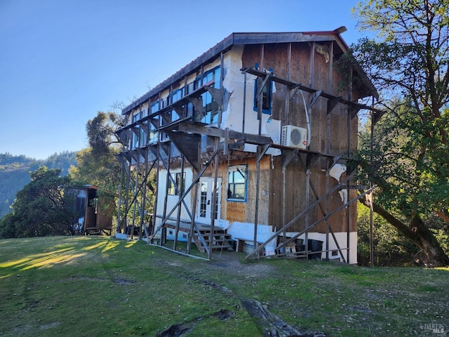 back of house with a yard