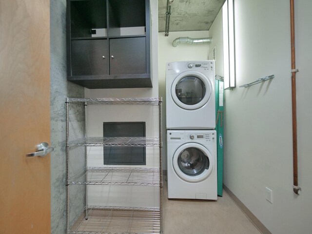 washroom with stacked washer / dryer