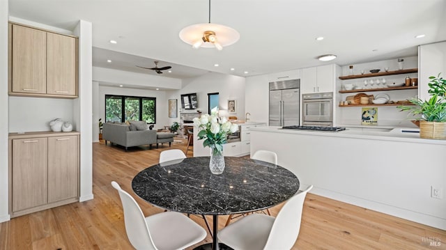 dining area featuring recessed lighting and light wood finished floors