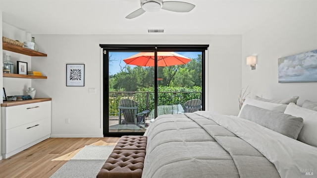 bedroom featuring access to exterior, visible vents, light wood-style floors, ceiling fan, and baseboards