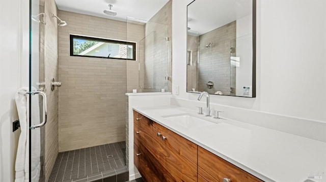 bathroom featuring a stall shower and vanity