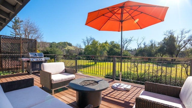 deck featuring a yard, area for grilling, and an outdoor living space with a fire pit