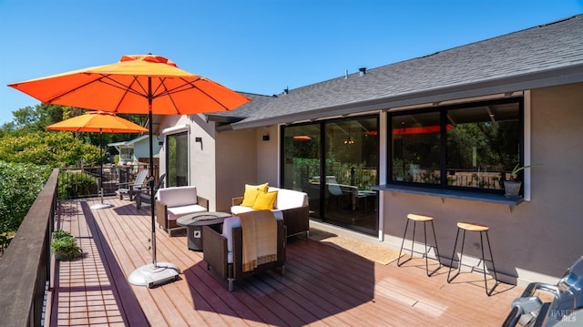 wooden deck with a fire pit