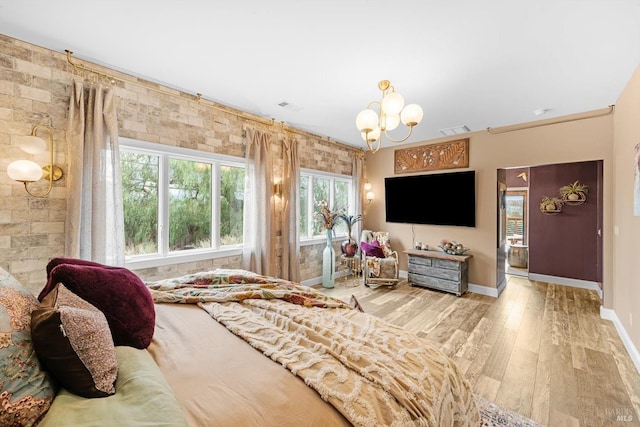 2135 E 2nd St, Benicia, CA 94510 - bedroom with a notable chandelier, baseboards, visible vents, and wood finished floors