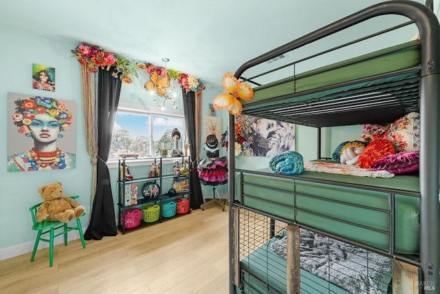 bedroom featuring wood finished floors