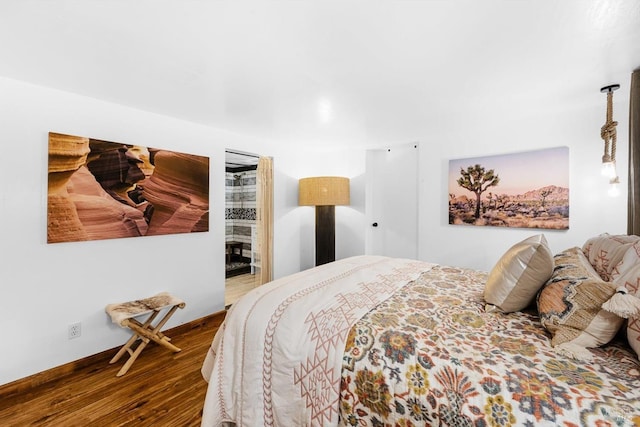 bedroom with wood finished floors