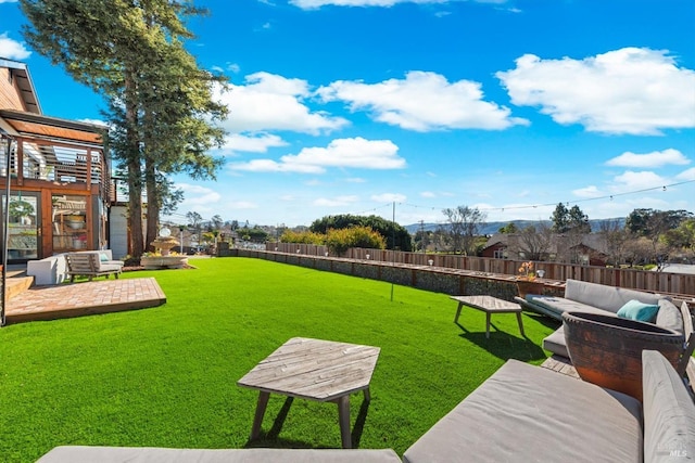 view of yard featuring a fenced backyard, an outdoor living space, and a patio