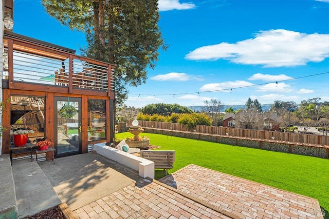 view of patio featuring fence