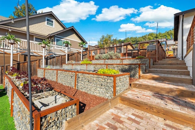 view of yard with a fenced backyard and a vegetable garden