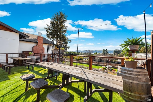 view of property's community featuring fence and a yard