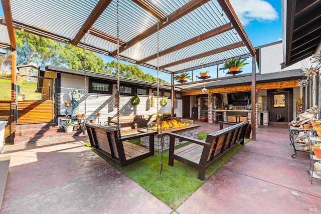 view of patio with an outdoor fire pit and a pergola