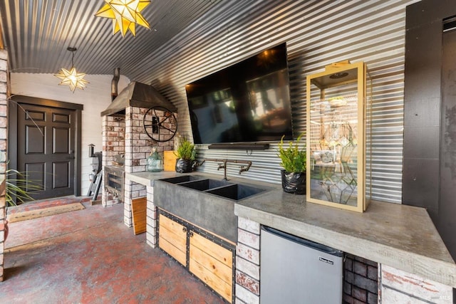 view of patio with exterior kitchen and a sink