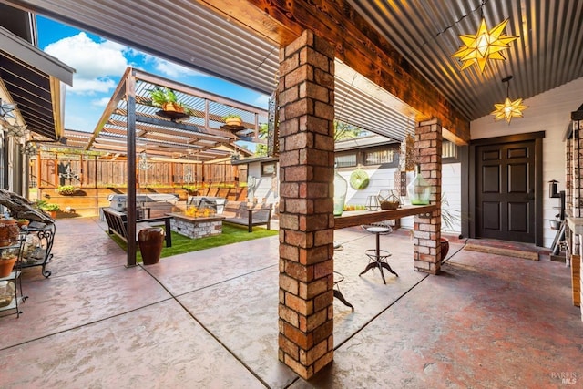 view of patio / terrace with fence, an outdoor living space, and a pergola