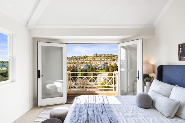 carpeted bedroom with baseboards, beam ceiling, and crown molding