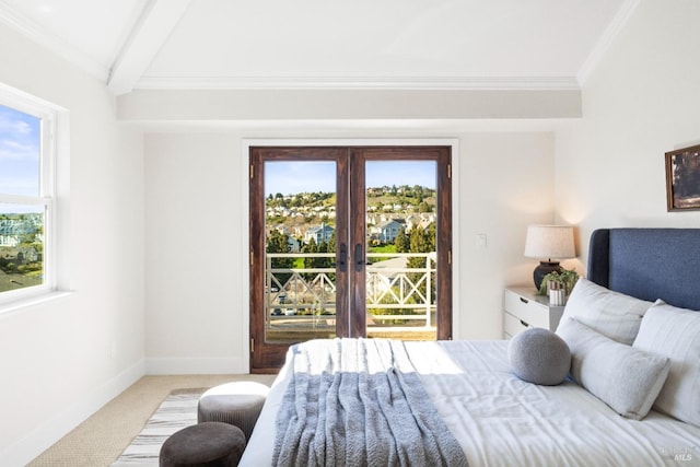 bedroom featuring access to exterior, light carpet, baseboards, and multiple windows