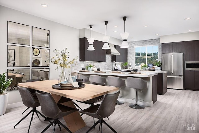 dining room with light hardwood / wood-style flooring