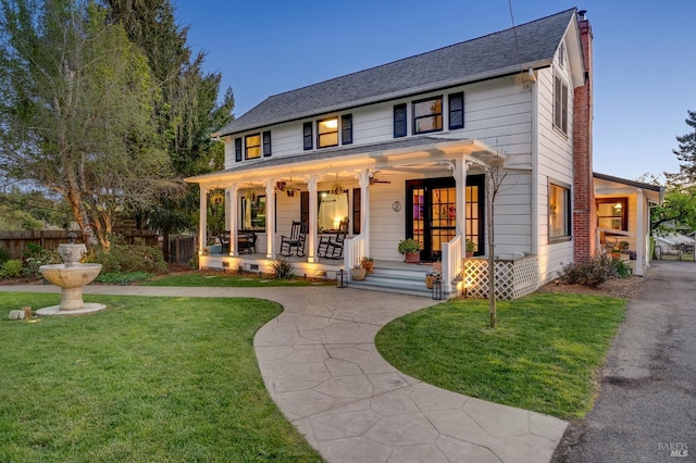 view of front of house featuring a yard and covered porch