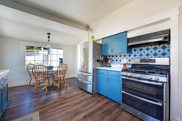 kitchen featuring extractor fan, stainless steel appliances, decorative backsplash, blue cabinetry, and vaulted ceiling