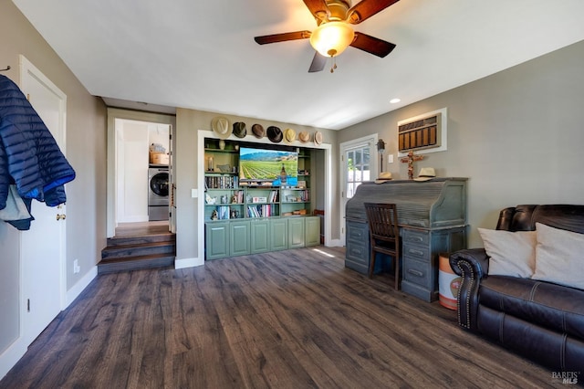 living room with ceiling fan, dark hardwood / wood-style flooring, and washer / dryer