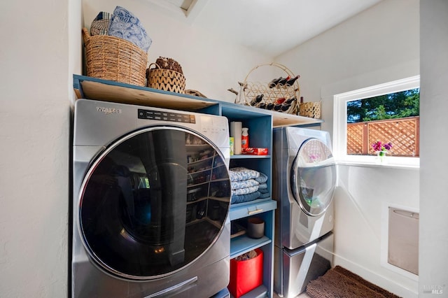 clothes washing area featuring washer / clothes dryer