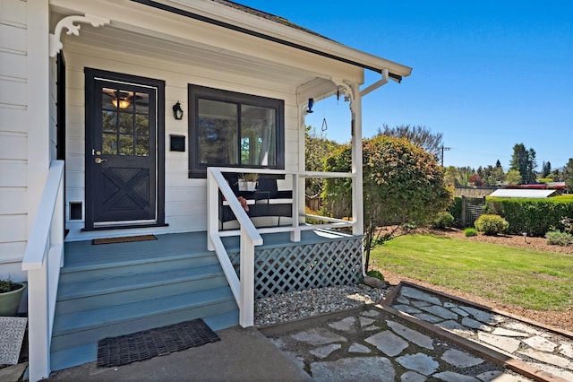 property entrance featuring a yard