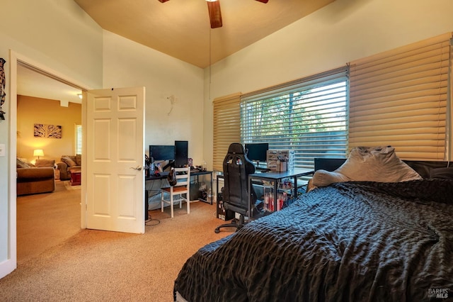 bedroom featuring ceiling fan, carpet, and lofted ceiling